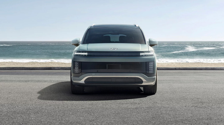 A mint green Hyundai Ioniq 9 near a beach.