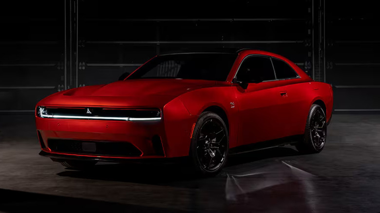 A red Dodge Charger Daytona EV in a garage