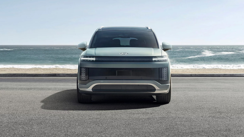 A Hyundai Ioniq 9 from a straight-on view near a body of water