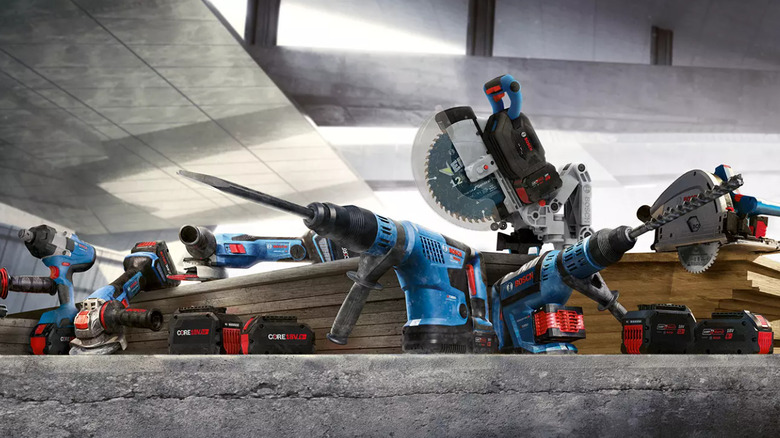 a variety of Bosch power tools on a concrete slab