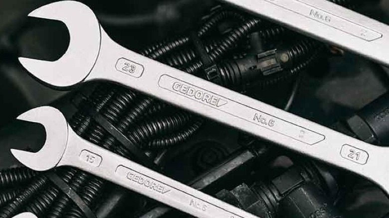 Gedore wrenches on top of engine