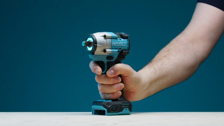 Person holding Hazet power tool on table