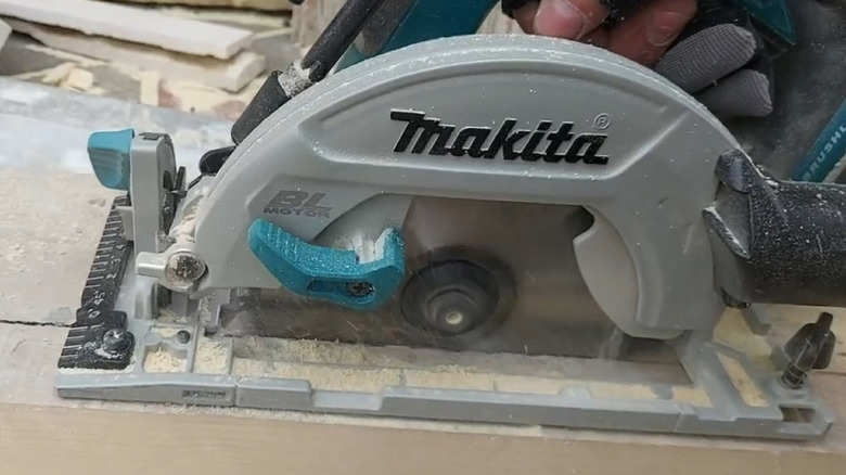 Makita saw cutting through wood