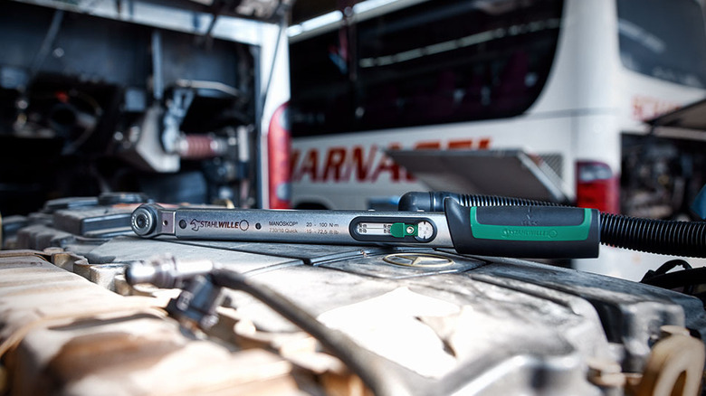 A Stahlwille torque wrench placed on a surface in an industrial setting.