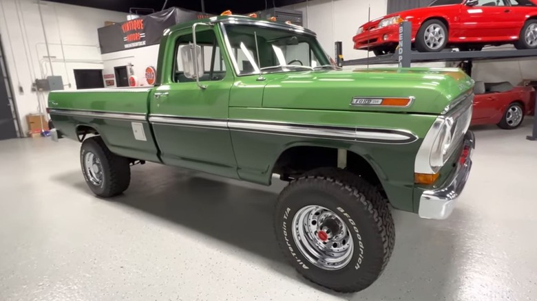 Two-tone Mallard Green Ford pickup in a warehouse