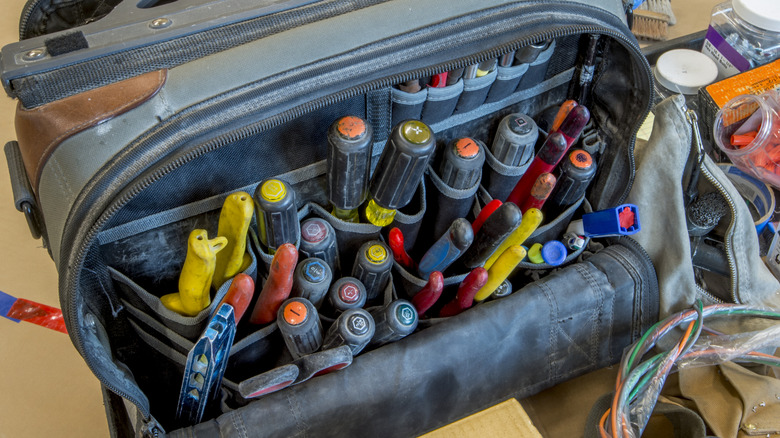 electrician's bag open and full of tools