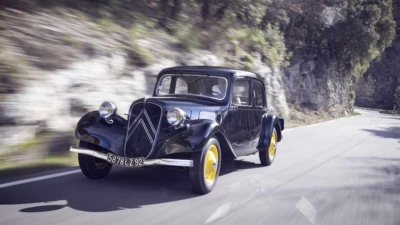 The Citroën Traction Avant driving on a mountain road