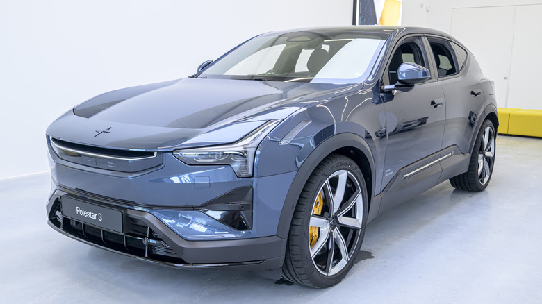 A dark gray Polestar 3 in a building