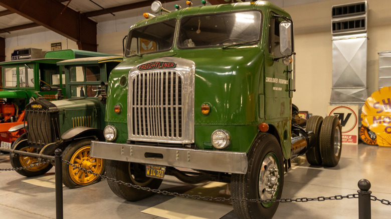 A dark green Freightliner bubblenose truck displayed at the Iowa truck museum