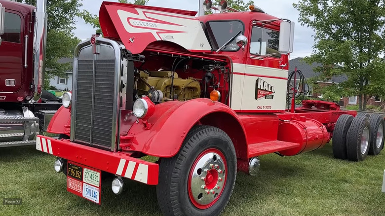 A red Kenworth CD 524 semi truck