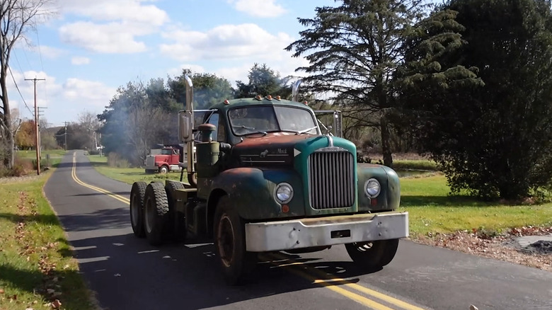 An old 1957 Mack B61 semi truck, dilapidated but still beautiful