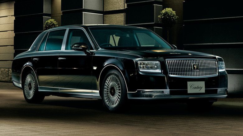 Third generation Toyota Century parked at an upscale hotel