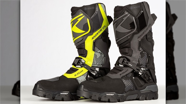 Boots in two different colors -- yellow and grey and black and grey