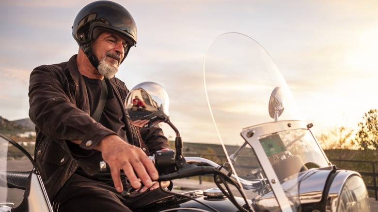 An old man on a motorcycle