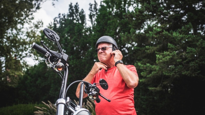 An older man wearing a helmet