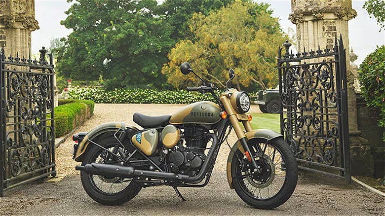 Royal Enfield Classic 350 motorcycle by gates of stately home