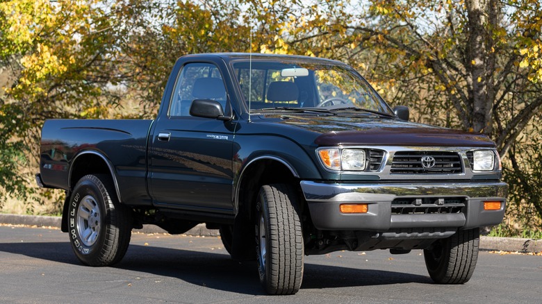 An older-generation Toyota Tacoma single cab pickup truck outside in a parking lot