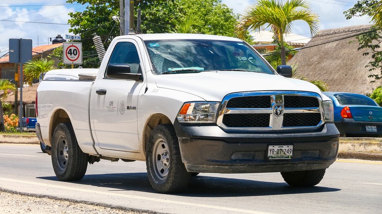 A dodge RAM 1500 pickup truck at a city street