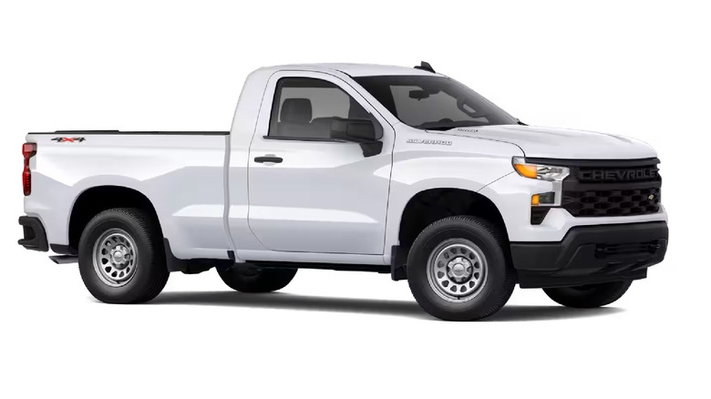 A white GMC Sierra 1500 with the right profile visible, against a studio background