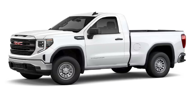 A white GMC Sierra for the 2025 model year, in regular cab configuration, with the left profile of the car visible
