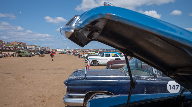 car show in dusty lot