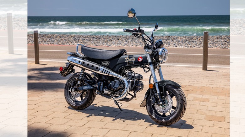 a Honda Dax 125 parked on the beach