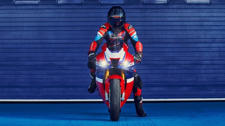 A Honda CBR1000RR-R Fireblade SP with a racer sitting on it