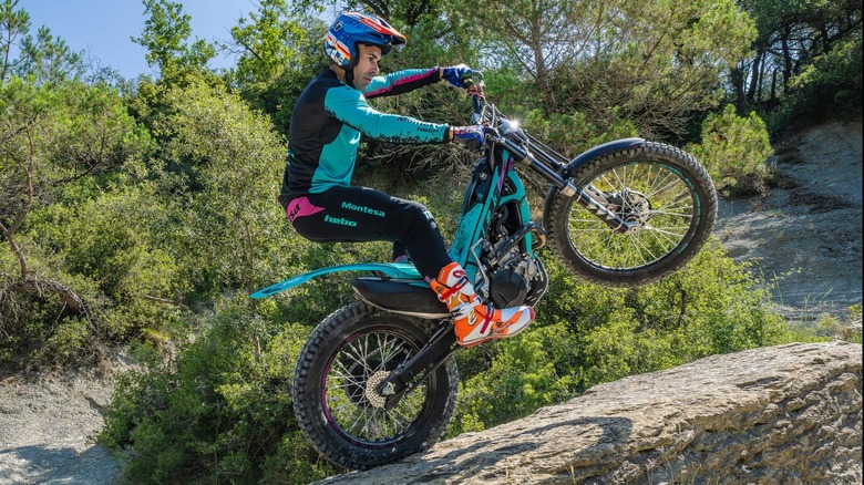 a rider taking the Honda Montesa Cota 4RT 301RR through an offroad trail