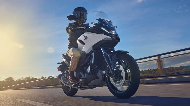 a rider cruising on a highway on a Honda NC750X DCT