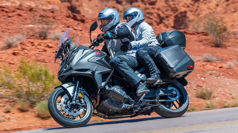 two riders on a Honda NT1100 DCT going through canyon roads