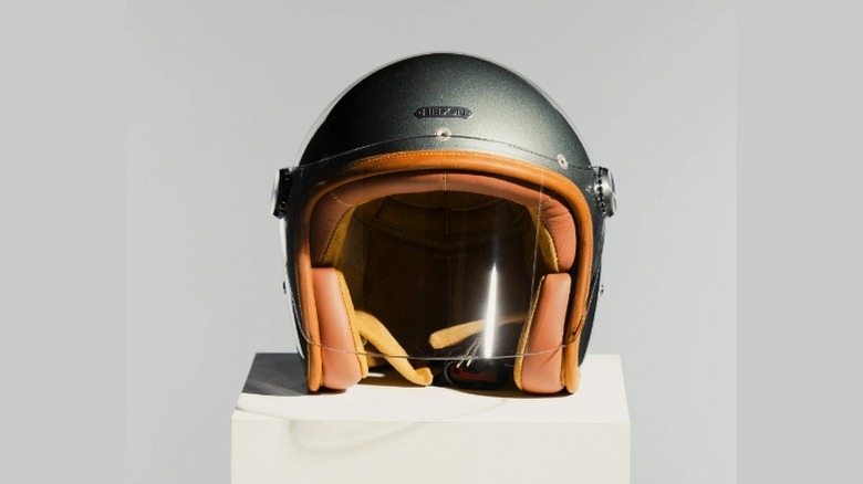 Open-face helmet with Glass Ash-colored shell and brown padding