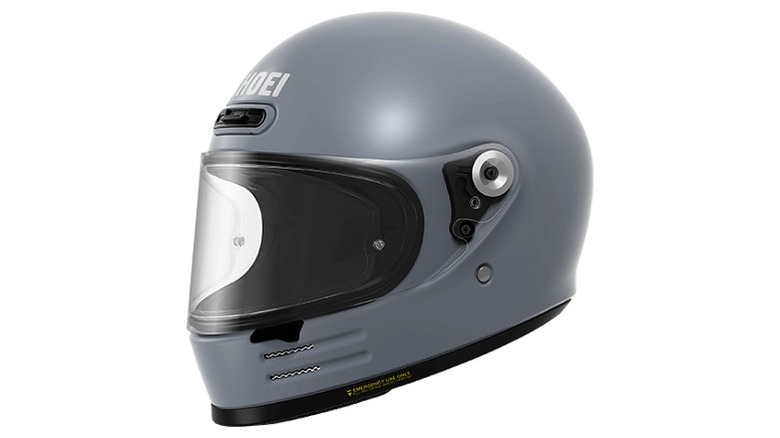 Grey helmet with Shoei logo on top and clear shield
