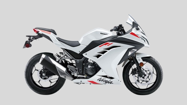 White Kawasaki Ninja 300 motorcycle on gray background