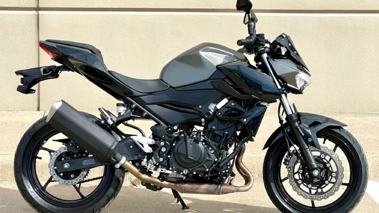 Used 2023 Kawasaki Z400 ABS motorcycle in parking lot