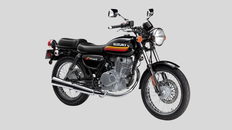 2019 black Suzuki TU250X motorcycle on gray background