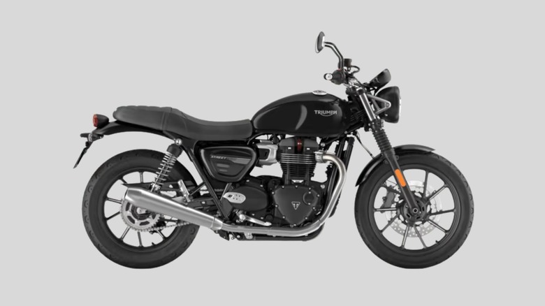 Black 2021 Triumph Street Twin on gray background