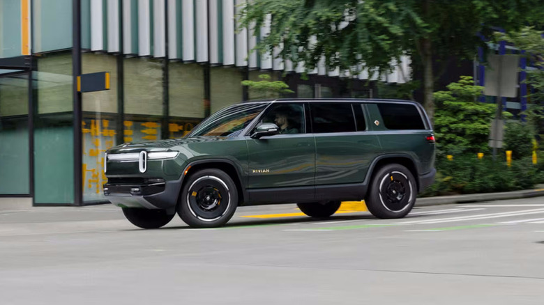 Rivian R1S driving in a city