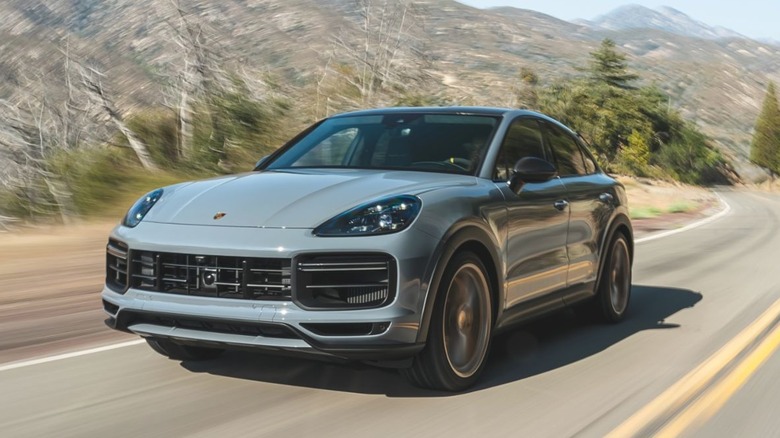 Porsche Cayenne Turbo GT Coupe driving down a road