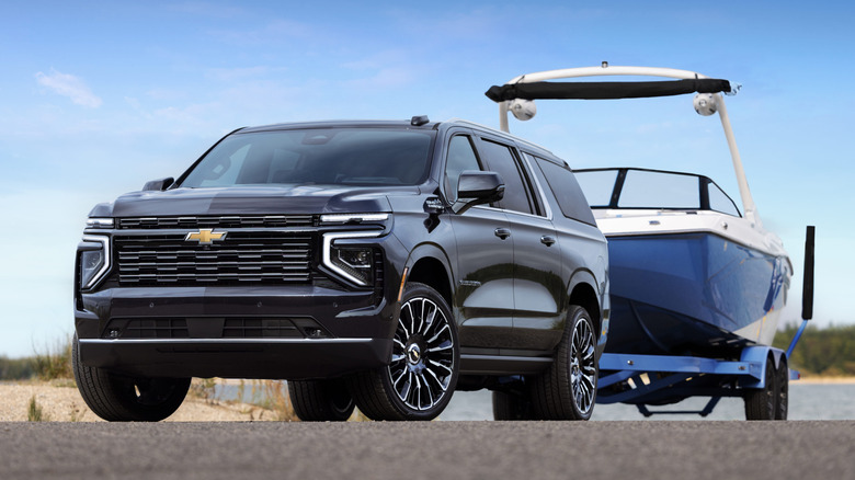 2025 Chevrolet Suburban towing a boat