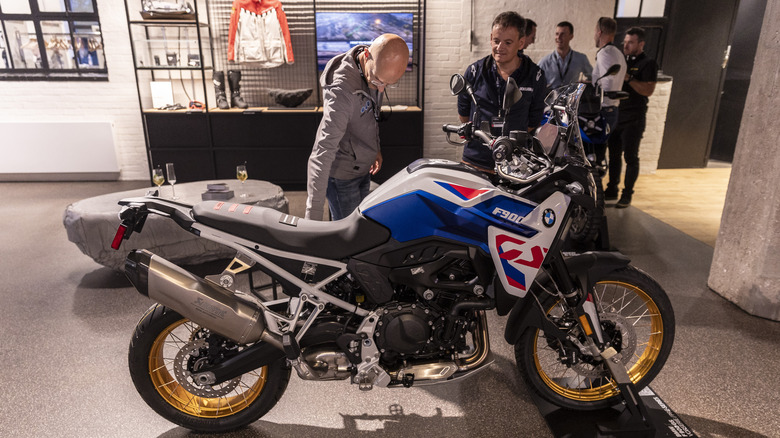 A bMW F900 base model on display at a podium at a launch event