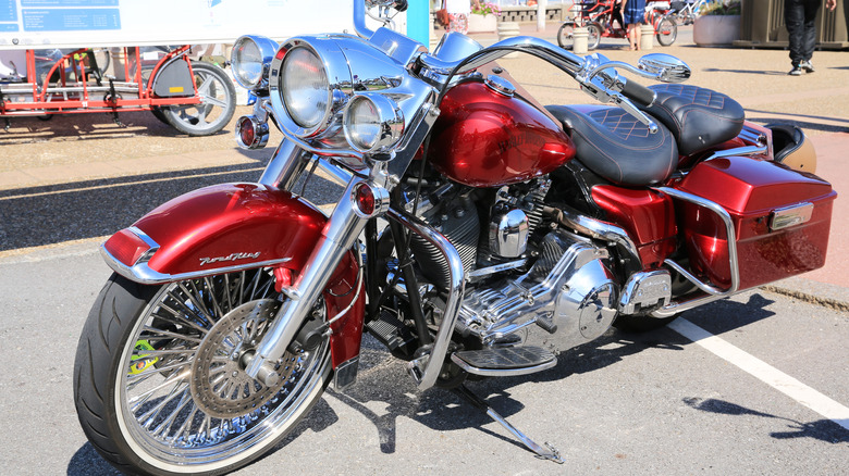 A Harley Davidson Road King in striking red at a road show in france