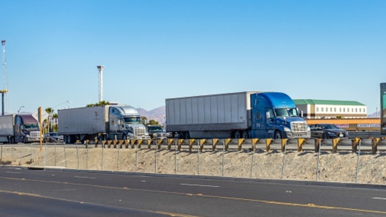 Semi-trucks in traffic on I-15 in California