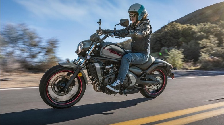A woman driving a Kawasaki Vulcan S