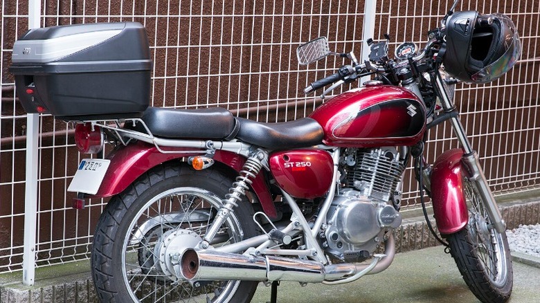 A red Suzuki TU250X
