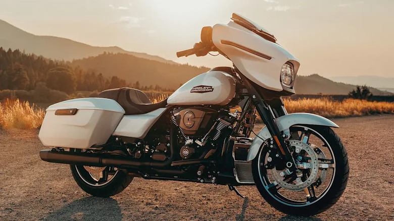 A gorgeous white 2025 Street glide photographed at the side of a dusty road in the afternoon