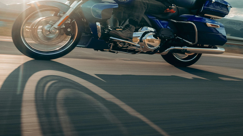 A rider in full kit on a blue 2025 Harley Street Glide ultra