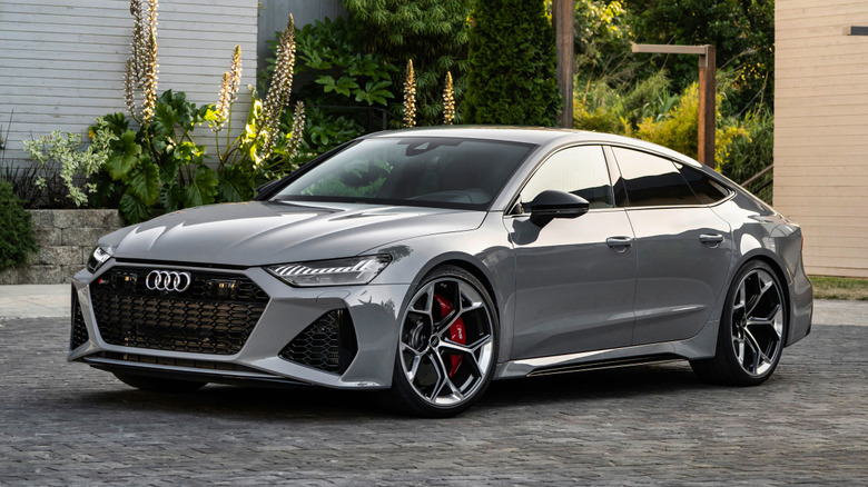 Gray Audi RS7 Performance parked in front of buildings