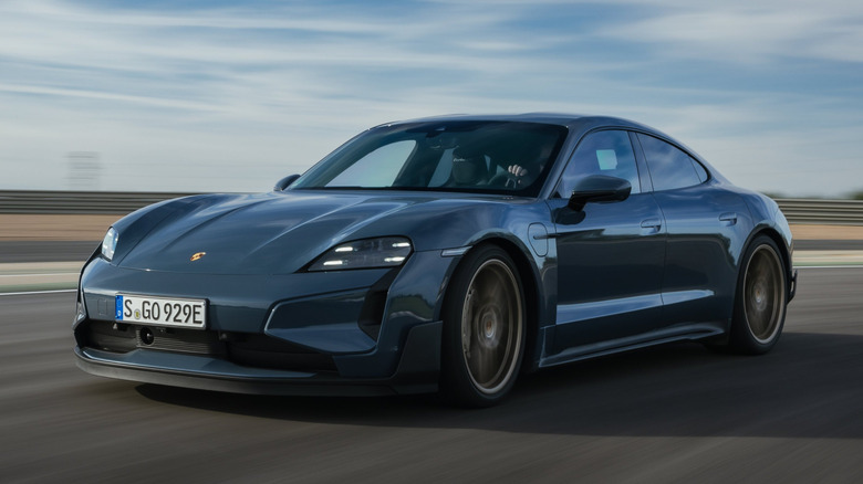 Blue Porsche Taycan Turbo GT cornering on a race track