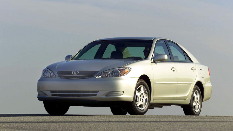 A silver 2002 Toyota Camry parked