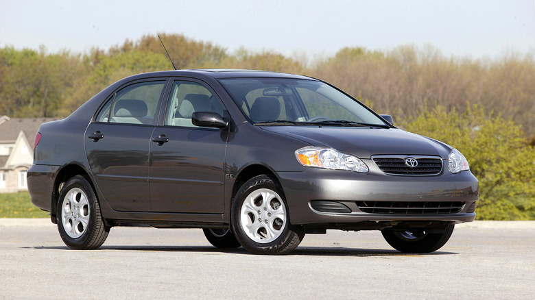 A dark gray 2008 Toyota Corolla parked